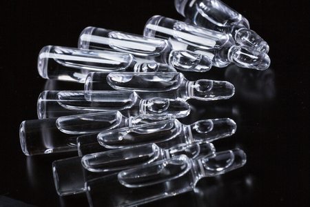 Studio photo medical ampoules on a black backgroundの写真素材