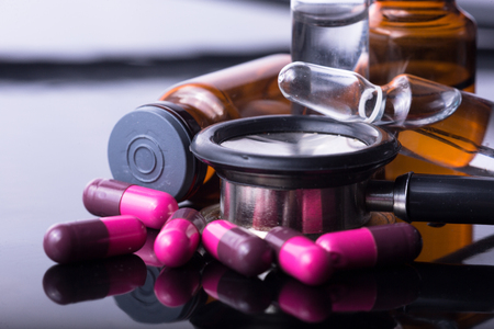 studio photo medical drugs to treat people in backgroundの写真素材