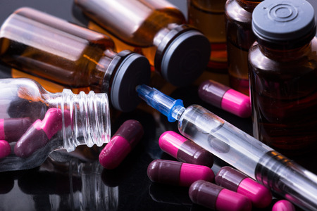 studio photo medical drugs to treat people in backgroundの写真素材