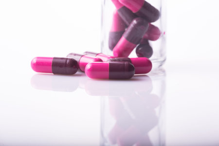 studio photo medical drugs to treat people in background