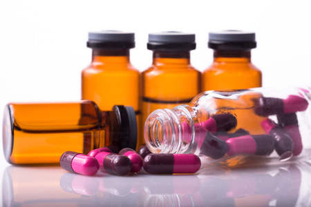 studio photo medical drugs to treat people in backgroundの写真素材