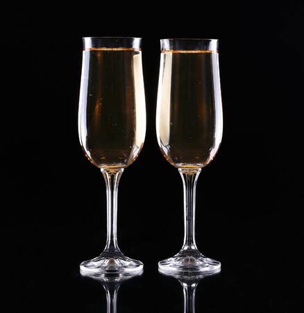 two glasses of champagne over black backgroundの写真素材