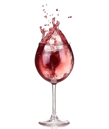 Wine collection - Splashing red wine in a glass. Isolated on white backgroundの写真素材