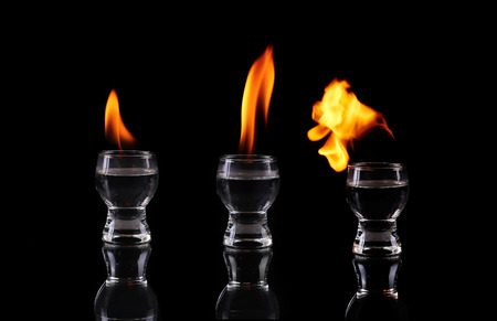 collage Glass of tequila and flamesの写真素材