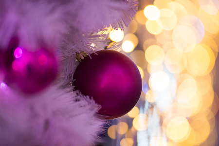 beautiful Christmas toy on outdoor Christmas decorations with beautiful bokeh of garlandsの写真素材