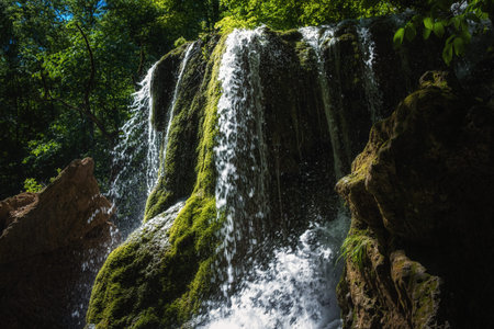 A beautiful waterfall deep in the tropical forest, steep mountain adventure in the rainforest....