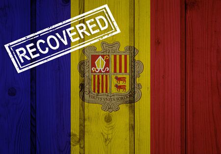 flag of Andorra that survived or recovered from the infections of corona virus epidemic or coronavirus. Grunge flag with stamp Recoveredの写真素材