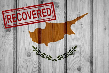 flag of Cyprus that survived or recovered from the infections of corona virus epidemic or coronavirus. Grunge flag with stamp Recoveredの写真素材