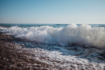 Beautiful blue wave in tropical ocean. Turquoise wave barrel crashing in sea. Close up.の写真素材