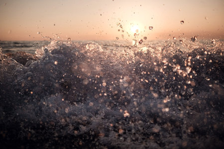Sea waves sky landscape. Sunset sea waves crashing and waves splashing. Cargo ship sunset horizon...