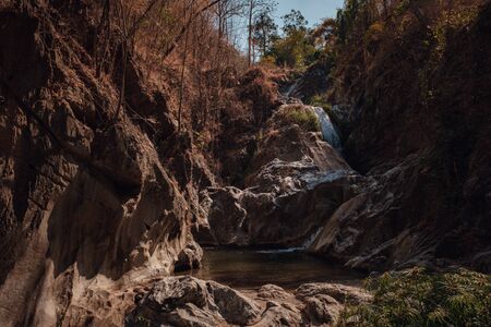 deep forest waterfall at Lan sang national park, Tak, Thailand. Tak Province Drought Seasonの写真素材