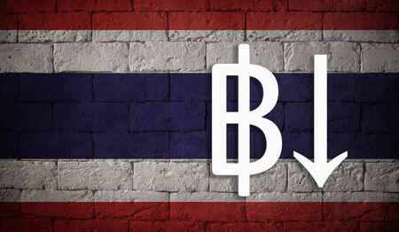 symbolic depreciation of the national currency Baht against of the country flag of Thailand. Concept of depreciation of currency, economy fall and the breakdown of economic tiesの写真素材