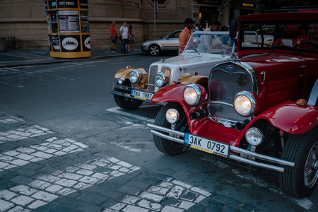 Prague, Czechia - 10.08.2019. The architecture of the old city of Prague. Ancient buildings, cozy streets. Vintage sightseeing tour car waiting for tourists in old townのeditorial素材