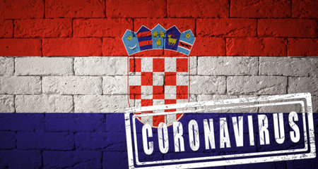 Flag of the Croatia with original proportions. stamped of Coronavirus. brick wall texture. Corona virus concept. On the verge of a COVID-19 or 2019-nCoV Pandemic.の写真素材