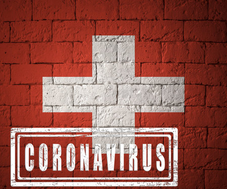 Flag of the Switzerland with original proportions. stamped of Coronavirus. brick wall texture. Corona virus concept. On the verge of a COVID-19 or 2019-nCoV Pandemic.の写真素材
