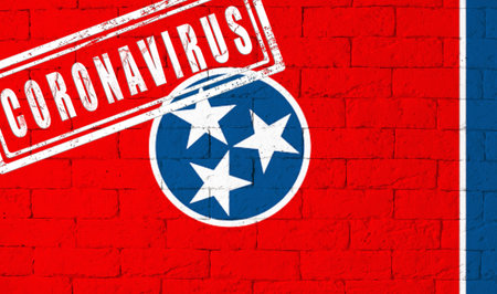 Flag of the State of Tennessee painted on grungy brick wall background. with stamp CORONAVIRUS, idea...