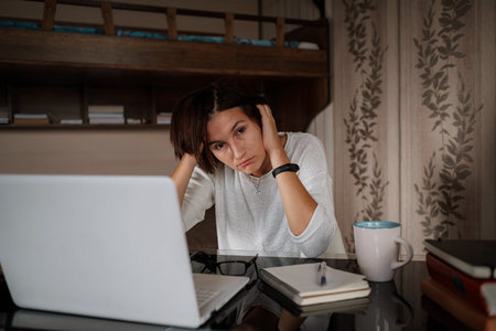 Thoughtful doubtful asian female student worker looking away thinking solving problem feel lack of...