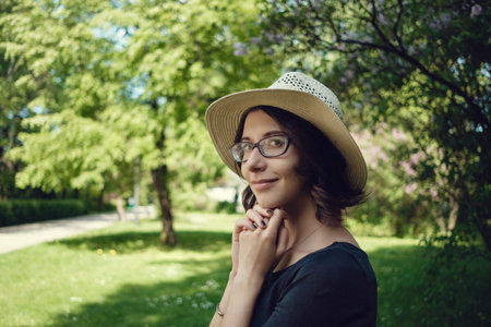 Young beautiful pregnant woman on a walk in the park of Warsaw, Poland. Lazienkiの写真素材
