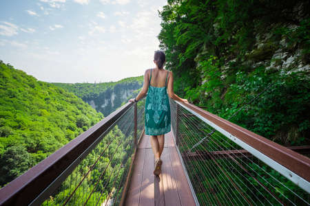 Aerial road in Okace Okatse canyon - Georgia. All rocks are covered with bright green foliage. Modern tourist landmark and attraction in Georgia mountains.の写真素材