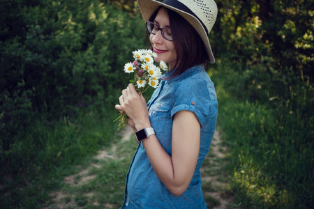 pregnant mom expecting in the summer field. The concept and idea of health, happiness and maternity