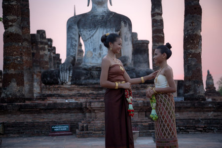 Sukhothai, Thailand - April, 9,2017: Beautiful Thai women in traditional costume of Thailand at Temple in Sukhothai Historical Park, Thailand.のeditorial素材
