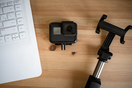 Work space on table of photographer. Minimal workspace with Laptop, camera and lens copy space on...