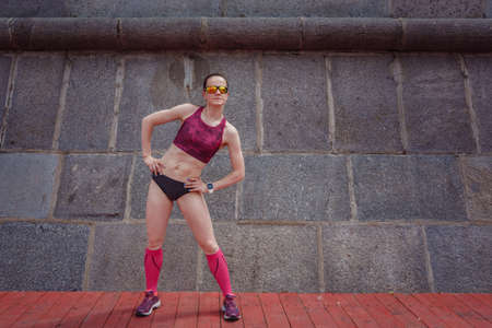 professional young female runner player running in park for training personal speed and explosive force at holiday weekend. The idea and concept of healthy lifestyle in a big city. Moscow Gorky Parkの写真素材