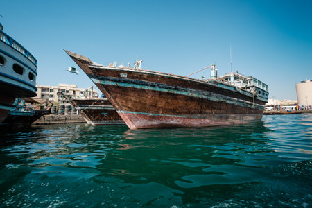 DUBAI, UAE - MARCH 7: Boats Abra ferries cruise business on the Bay Creek. Traditional arabic boats on the river. Old downtown of Dubai.のeditorial素材