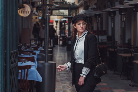 Beautiful stylish young latin woman walking the atmospheric streets of Istanbul, Turkey. The idea and concept of an interesting vacation, adventure in an amazing cityの写真素材