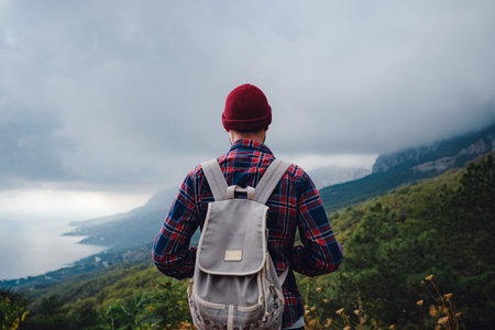 Man traveling with a backpack hiking in the mountains travel. Lifestyle success concept adventure,...