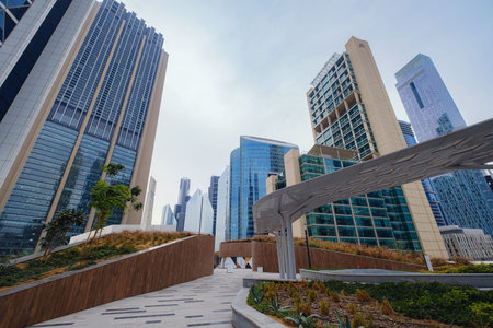 Dubai, UAE 19 February 2021: Dubai city downtown walk. Dubai capital gate tower exterior design. Gate Avenue in Dubai international financial center. (DIFC) Modern architecture.のeditorial素材
