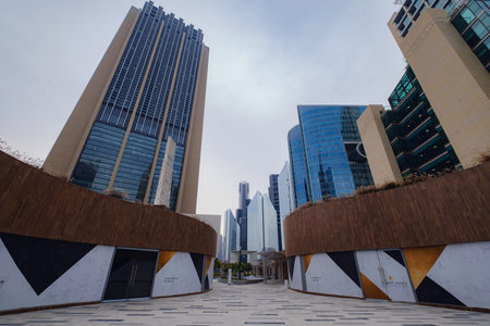 Dubai, UAE 19 February 2021: Dubai city downtown walk. Dubai capital gate tower exterior design. Gate Avenue in Dubai international financial center. (DIFC) Modern architecture.のeditorial素材