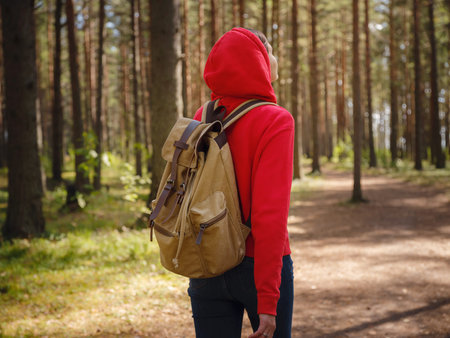 trip to central Russia, St. Petersburg, ecotrail Sestroretsky swamps. regenerative travel concept. Young woman hiking and camping in nature. backpack walking in green forestの写真素材