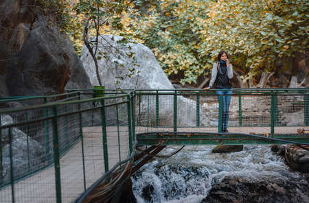 Happy asian woman is enjoy active hiking along the Saklikent Gorge in Turkey. New experience and outdoor leisure recreationの写真素材