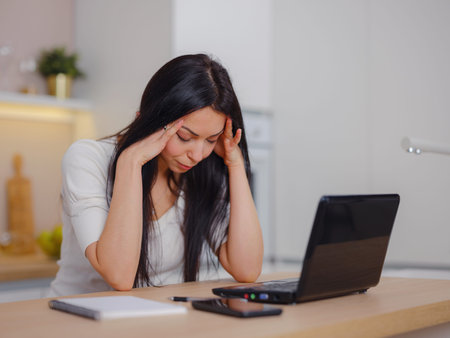 Stressed overworked business woman working from home , feel eye strain fatigued from laptop...
