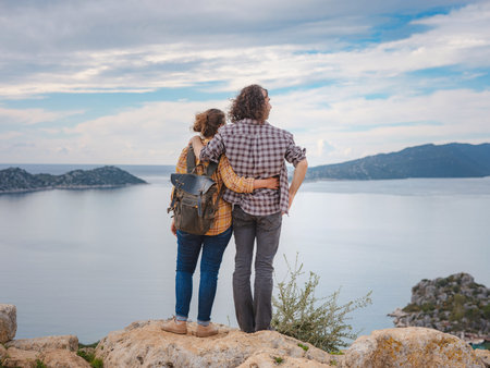 Couple traveler explore ruins castle of Simena with view of sea bay and Kekova Island with famous...