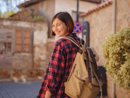 travel to Turkey, old town Antalya Kaleci Famous tourist destination . Happy asian female tourist traveler with backpack walks in old city.の写真素材