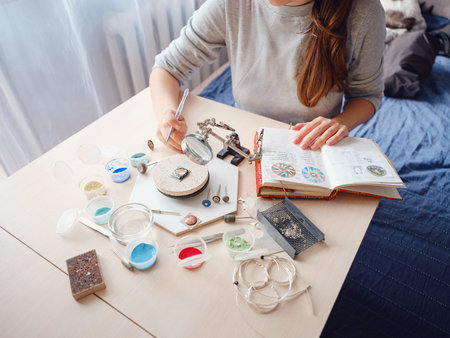 Lifestyle concept, work from home to reinvent your life - Jewelry designer workplace. Woman make...