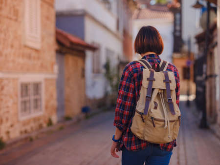 travel to Turkey, old town Antalya Kaleci Famous tourist destination . Happy asian female tourist traveler with backpack walks in old city.の写真素材