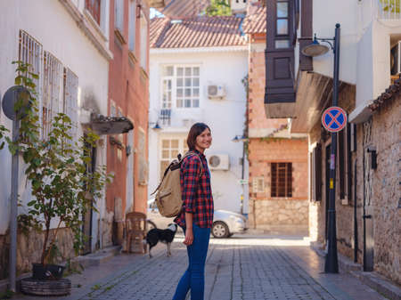 travel to Turkey, old town Antalya Kaleci Famous tourist destination . Happy asian female tourist traveler with backpack walks in old city.の写真素材