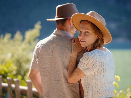 Travelers couple look at mountain lake. Love and Travel happy emotions Lifestyle concept. Young family traveling active adventure vacations. Adventure and travel in mountains region in Turkeyの写真素材