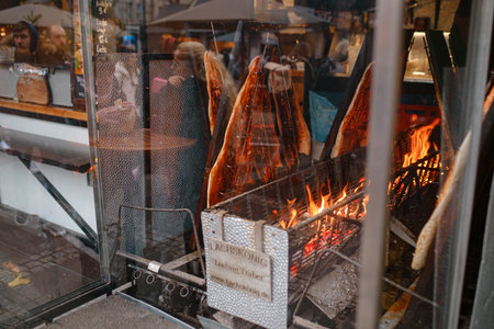 Cologne, Germany - December 13, 2022: different types of christmas goodies at Christmas market in Cologne, Germany. grilled fishのeditorial素材
