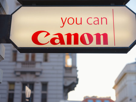 Vienna, Austria - August 9, 2022: Outdoor signage board with Canon Inc. logo. Japanese multinational corporation manufacturing imaging and optical products, including cameras, camcorders, photocopiers, computer printersのeditorial素材