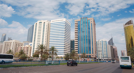 Abu Dhabi, UAE - March 19, 2023 Famous skyscrapers of Abu Dhabi city skyline with beautiful clouds. street lifeのeditorial素材
