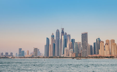 Dubai, United Arab Emirates, March 26, 2023: View of A Jumeirah Beach Residence during sunset hour. Shot made from Palm Jumeirah, man made island.のeditorial素材