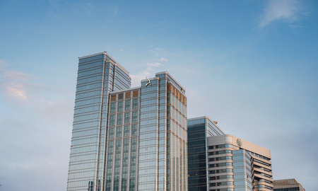 Abu Dhabi, UAE - March 19, 2023: Al Rawdah - Al Maarid - Abu Dhabi, skyscrapers against the background of the sunset sky, embassy districtのeditorial素材