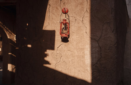 Vintage Lamp hanging outside the Al Seef Heritage Hotel, Dubai. Al seef old historical district with traditional Arabic architecture.の写真素材