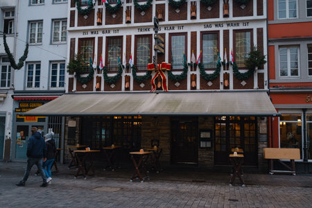 Dusseldorf. GERMANY. 13 DECEMBER 2022. The Christmas in Germany. Christmas market spirit. Celebrating Xmas holidays. Lights, carousel, small houses at market in city center with amazing food selectionのeditorial素材