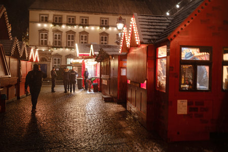 Dusseldorf. GERMANY. 13 DECEMBER 2022. The Christmas in Germany. Christmas market spirit. Celebrating Xmas holidays. Lights, carousel, small houses at market in city center with amazing food selectionのeditorial素材