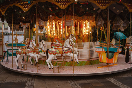 Cologne. GERMANY. 13 DECEMBER 2022. The Christmas market spirit. Celebrating Xmas holidays. Lights, carousel, small houses at the market in the city center with amazing food selection.のeditorial素材